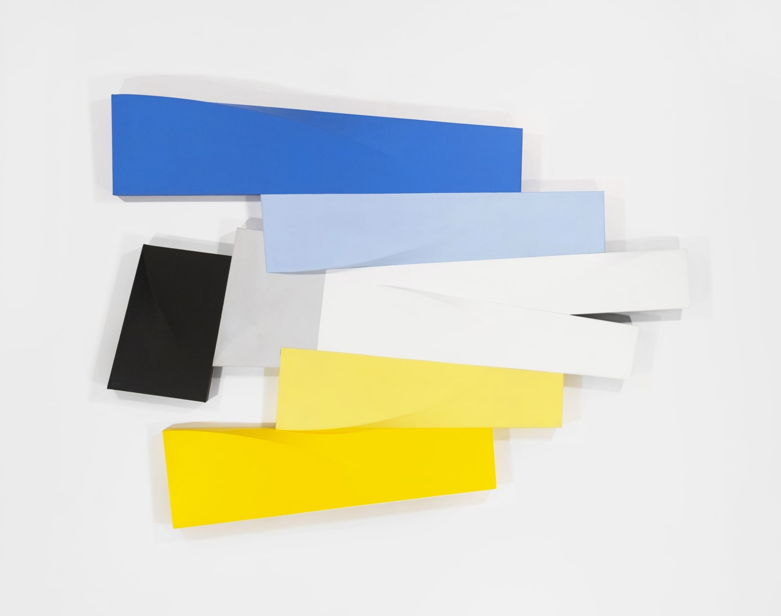 Tridimensional, bas relief horizontal painting made of interconnected trapezoid shapes (yellow, gray, blues, black)