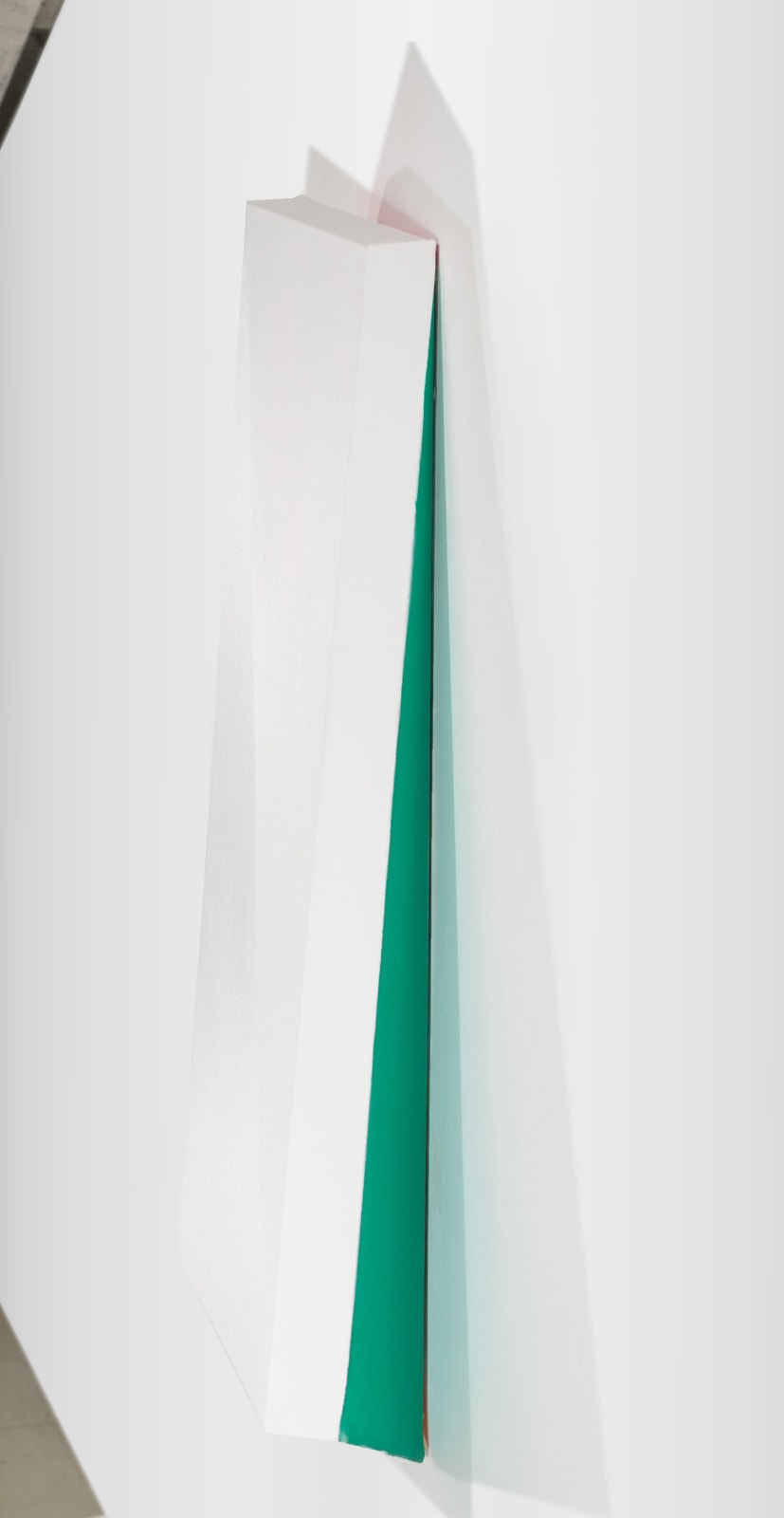 Detail of Tridimensional painting of a white prism a yellow side shadow