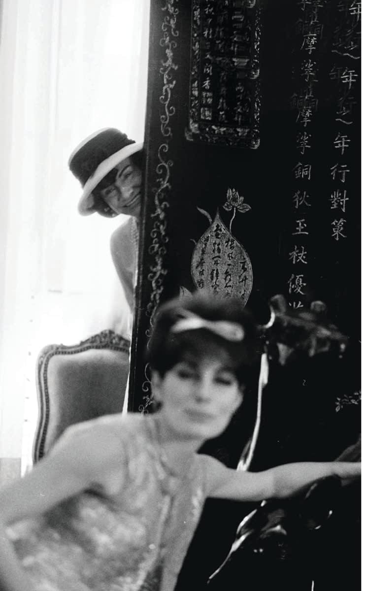 Douglas Kirkland Mademoiselle Chanel in her private apartment House of Chanel Paris hiding behind a valuable Coromandel screen 1962 Westwood Gallery NYC