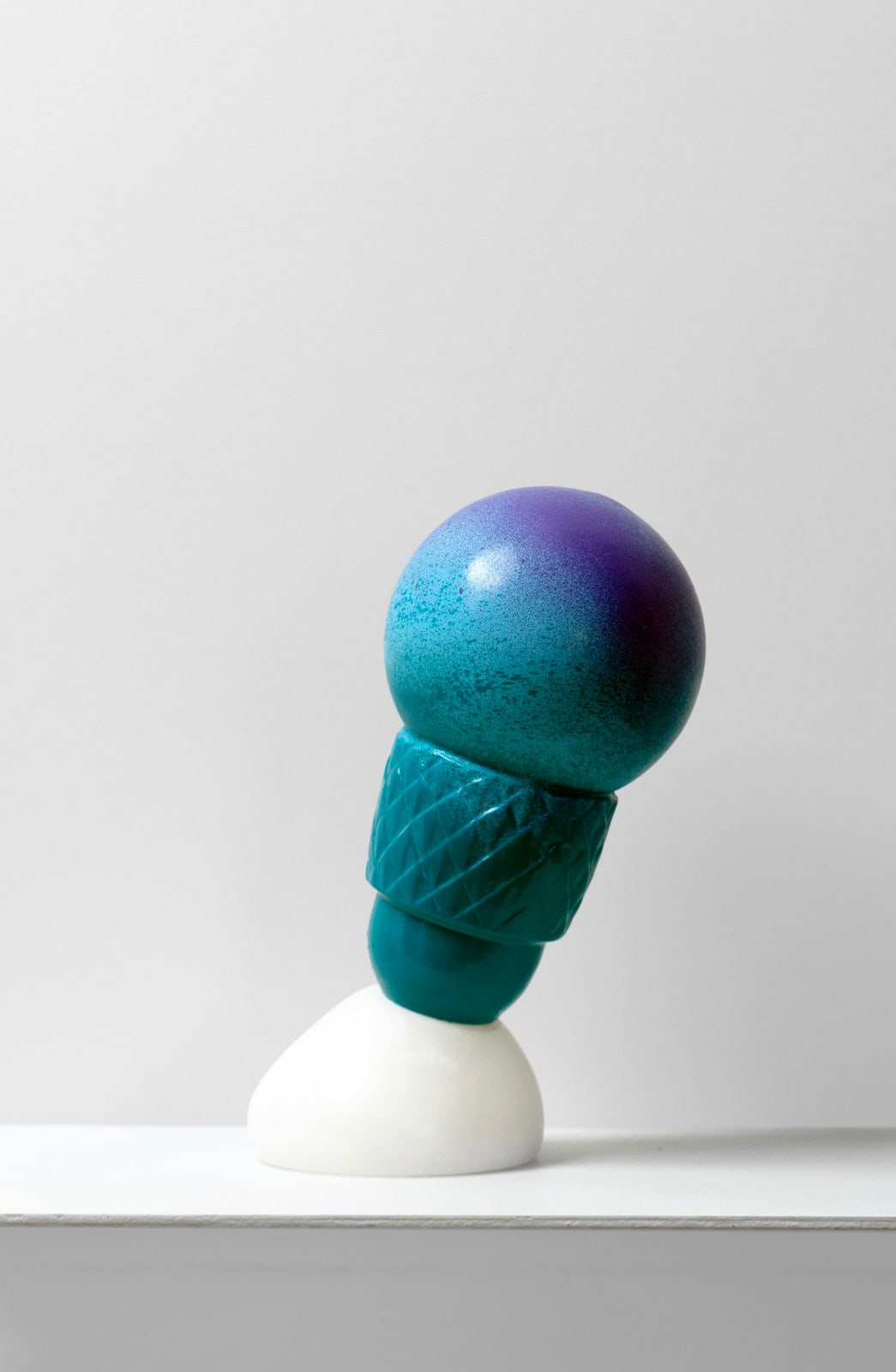 Contemporary minimalist sculpture made of stone and metal that resembles an ambiguous artifact