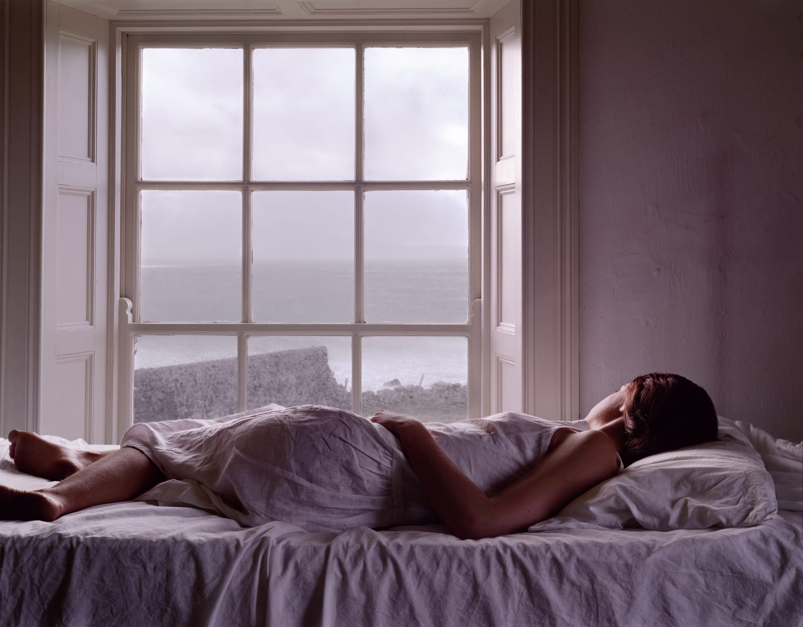 Danielle Nelson Mourning Self-Portrait on Bed, Mahery, Ireland. Archival Ink Print 46 x 59 in, 1 of 3 $10,000