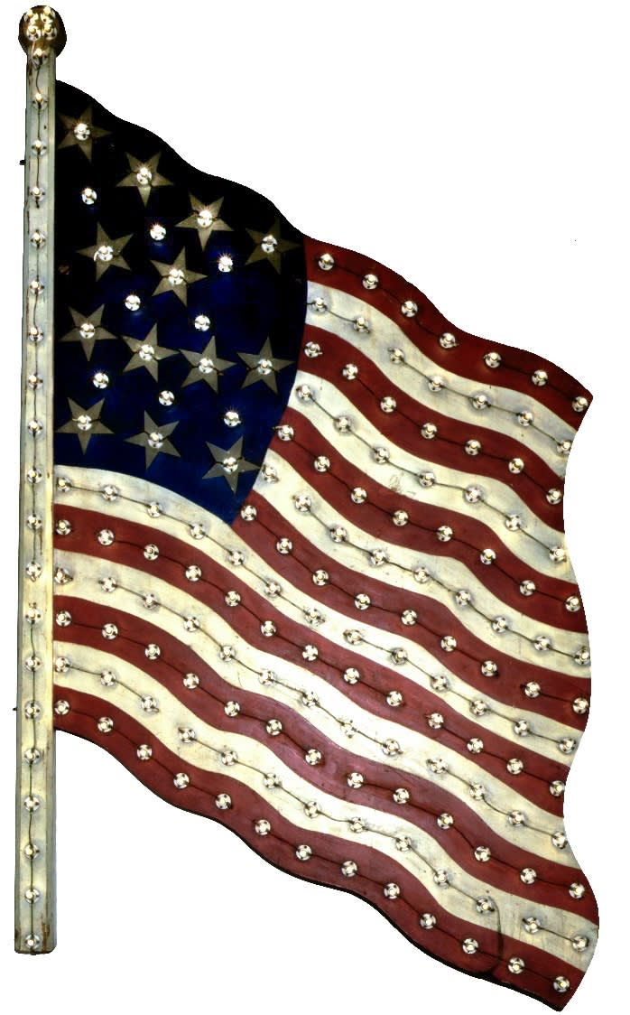 Artist Unknown American Flag Trade Sign, ca. 1930-40 Cut Painted tin, light bulbs, porcelain sockets 35 x 83 x 3 in. (88.9 x 210.8 x 7.6 cm.)