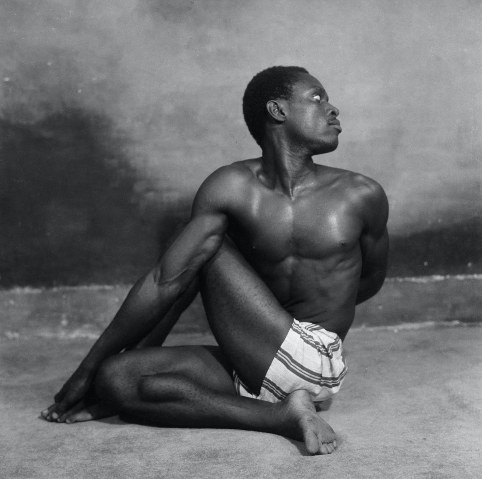 James Barnor, J Peter Dodoo Jnr, Yoga student of “Mr Strong”, Ever Young Studio, Accra, 1955
