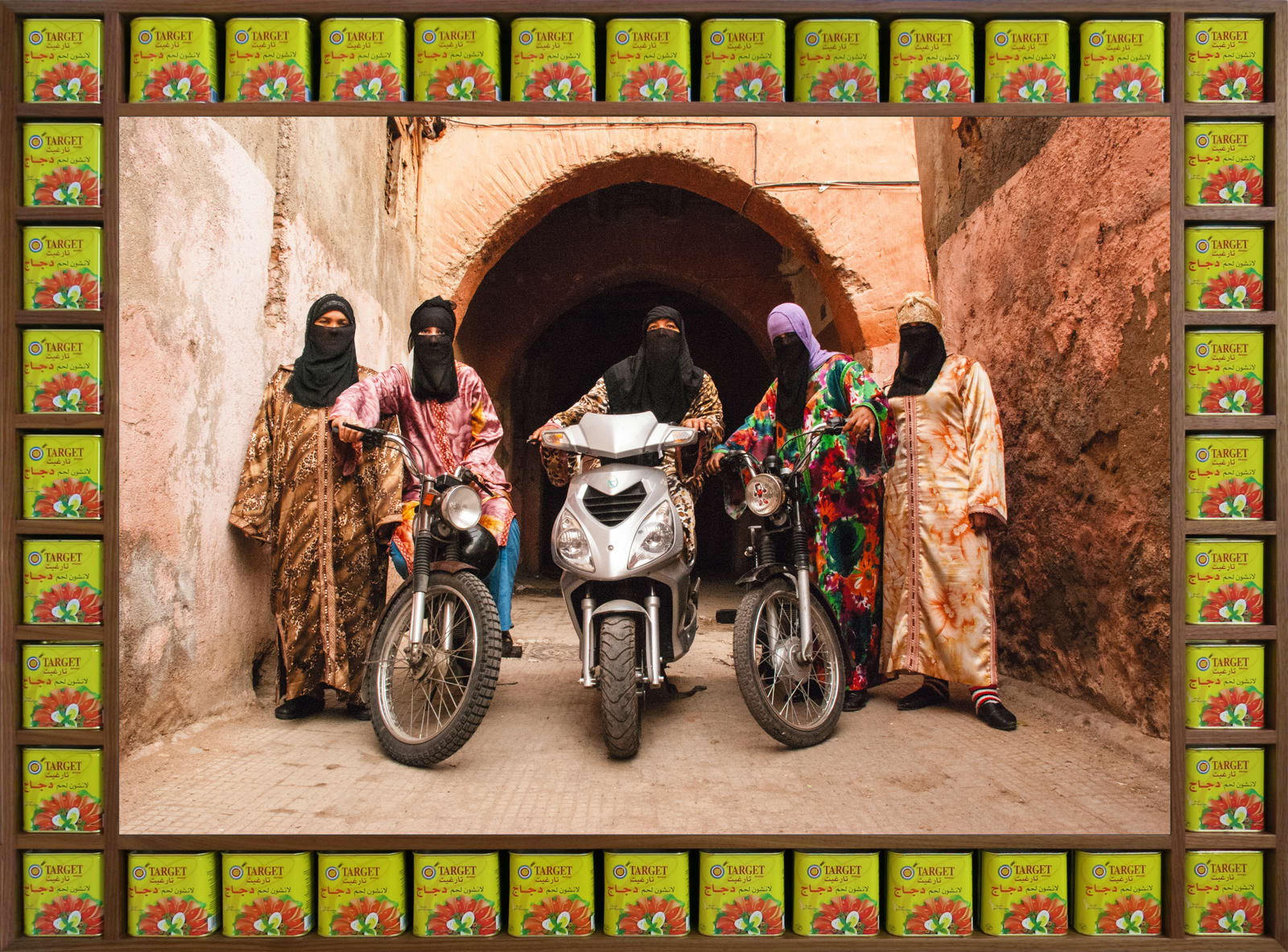 Hassan Hajjaj (Moroccan, b. 1961) Henna Angels, 2010/1431 Metallic Lambda on 3mm Dibond in a Walnut Frame with Halal Meat Tins Image: 30” x 44” (76 x 112 cm) Framed: 40” x 54 1/8” x 2 3/8" (101.5 x 137.5 x 6.5 cm) Edition of 7 plus 3 artist's proofs