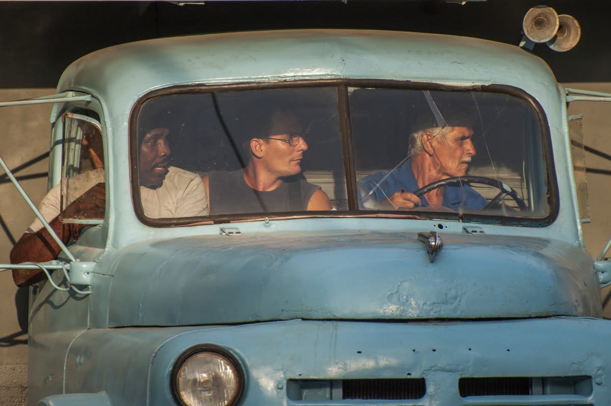 color photography portraiture men in a truck cuba