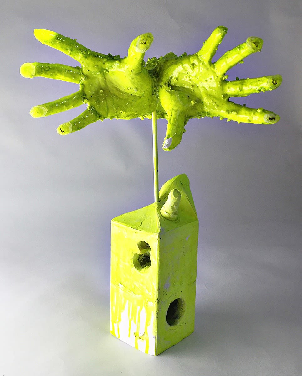 neon yellow green sculpture of hands