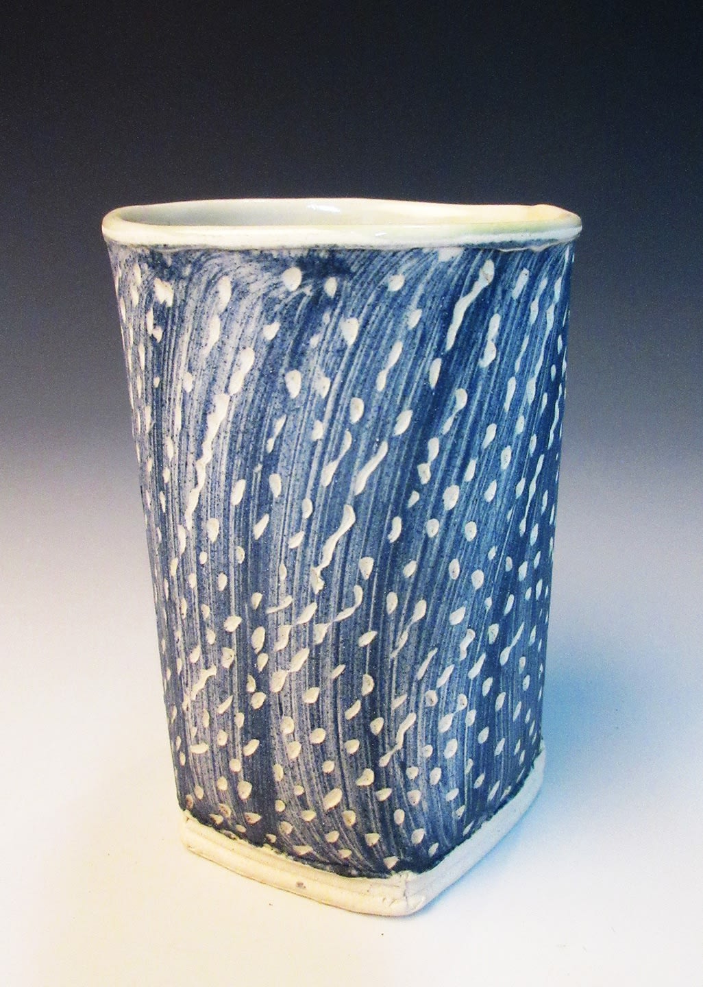 stoneware cup blue black glaze decorated