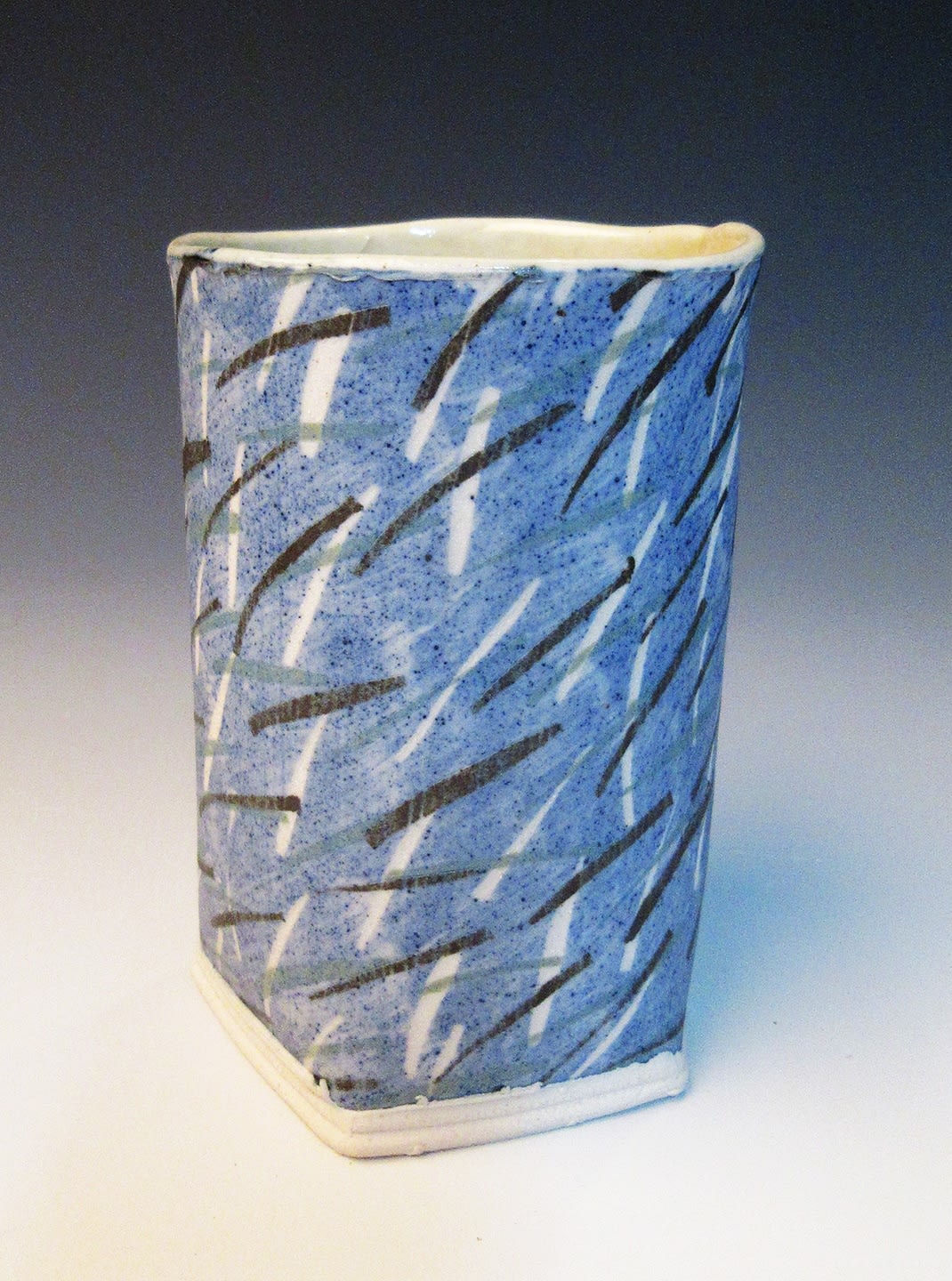 stoneware cup blue black glaze decorated