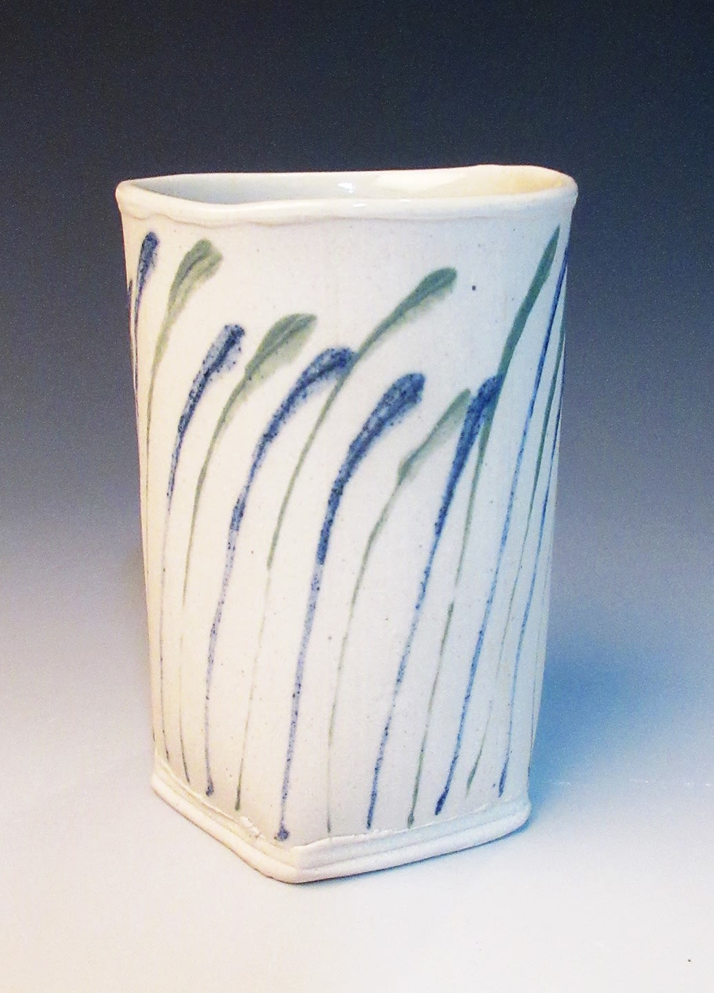 stoneware cup blue green glaze decorated