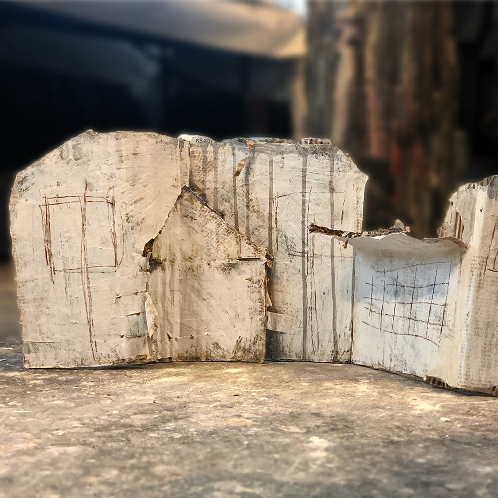 A cardboard house sculpture