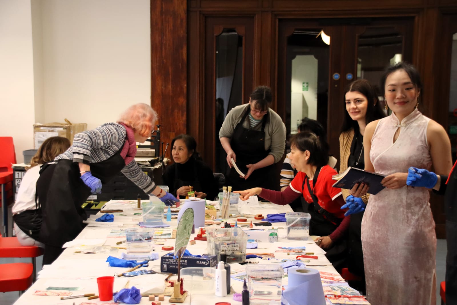 Attendees of free drop-in creative session in Chinese laquer.