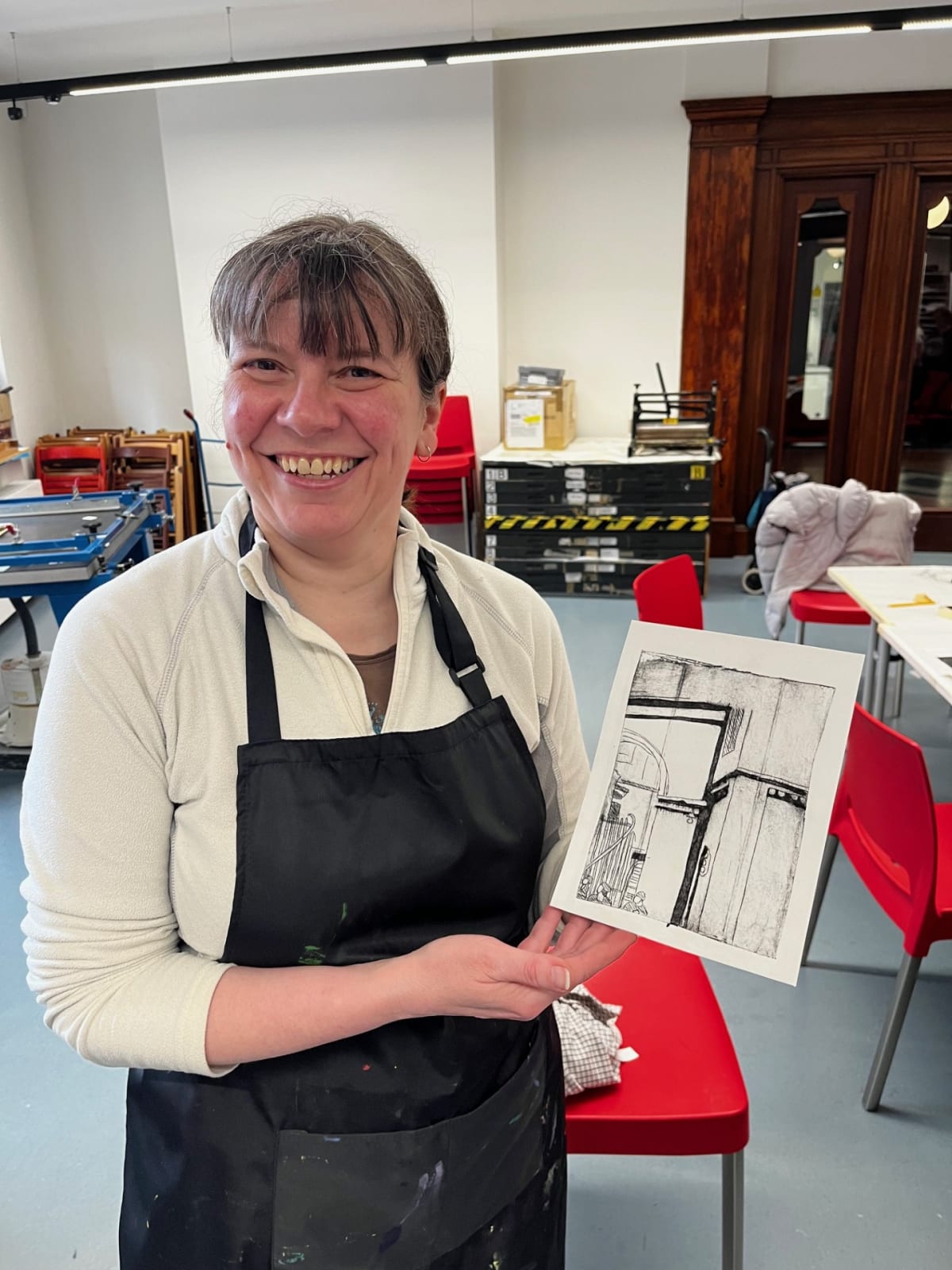 Attendee of free drop-in creative sessions in drypoint etching.