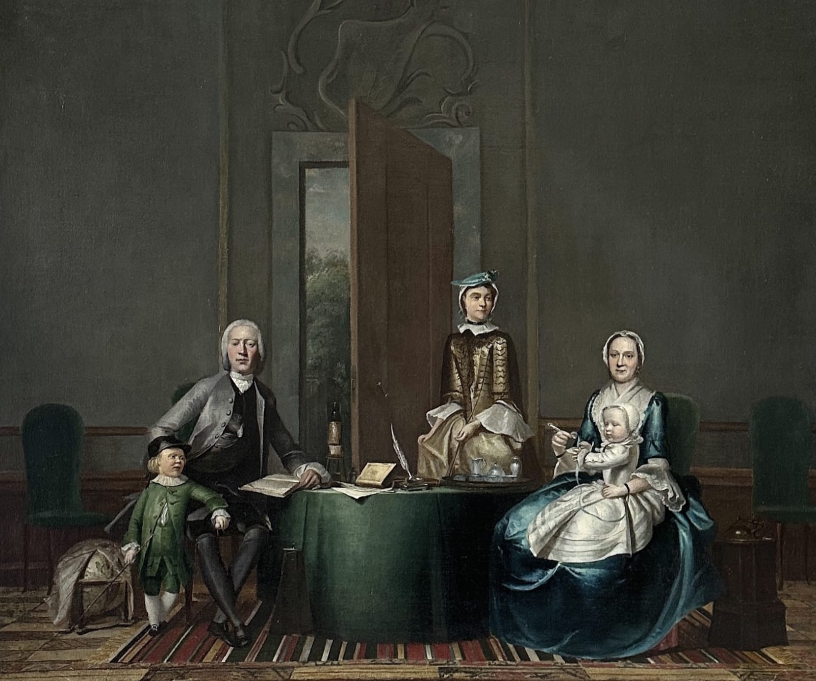 Hendrik Pothoven (Netherlands 1725-1807) , A portrait of a family in an interior