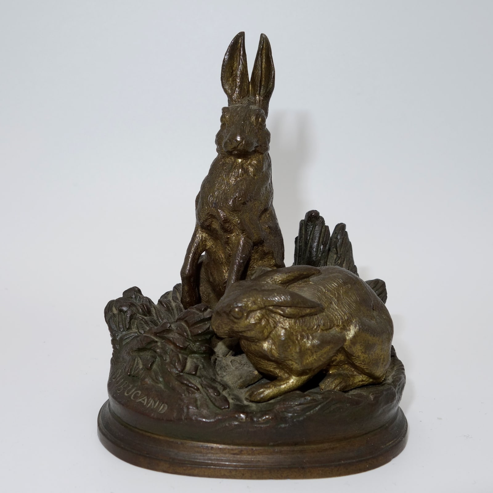 ALFRED DUBUCAND (1828-1894) , Group of hares in a naturalistic setting, c.1870