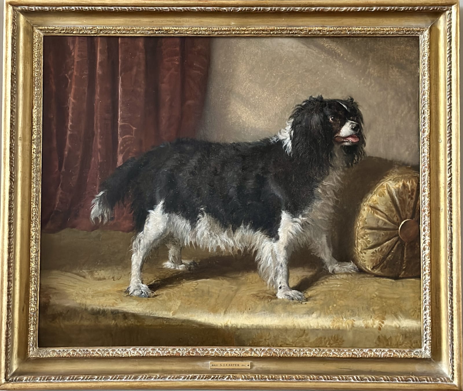 Samuel John Carter (1835-1892), A black and white spaniel in an interior