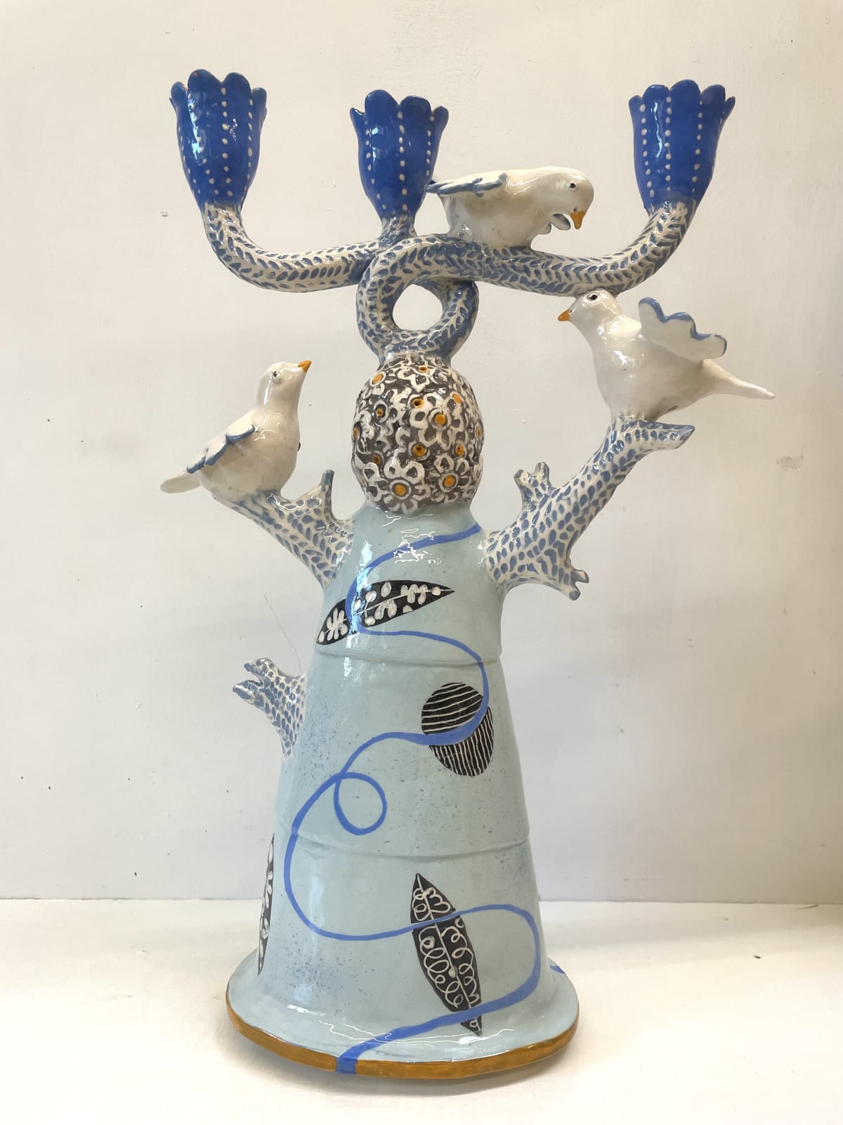 Three Cup Blue Candelabra with Doves, 2024 ceramic, 44 x 29 cms © The Artist
