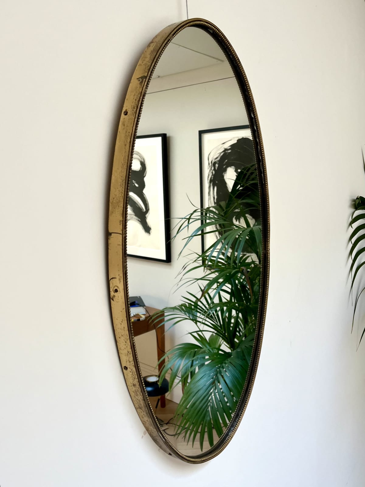 Italian, An Oval Brass Mirror, Circa 1960s