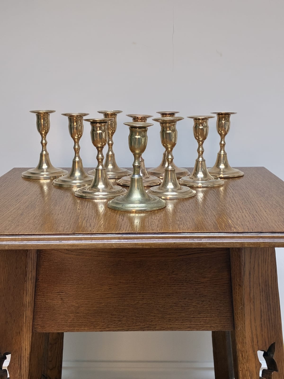 Swedish, A Collection of Nine Brass Candle Holders