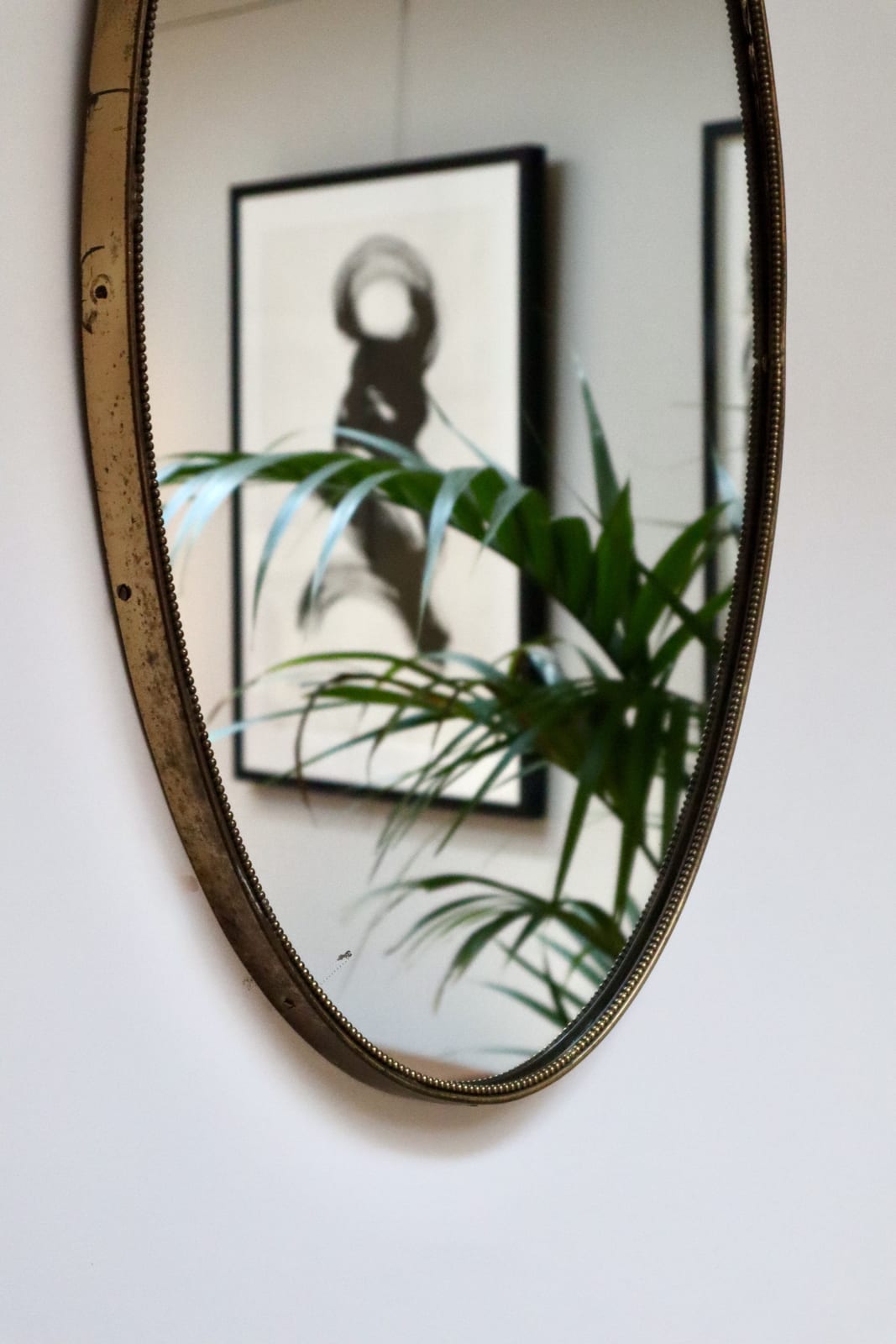Italian, An Oval Brass Mirror, Circa 1960s