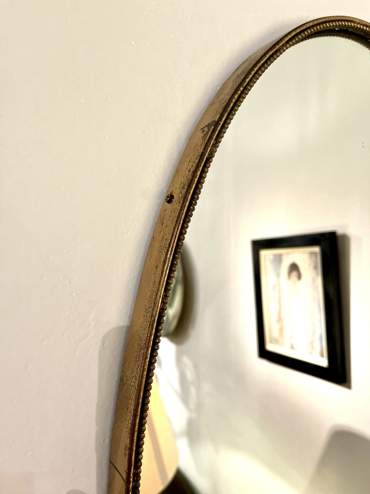 Italian, An Oval Brass Mirror, Circa 1960s