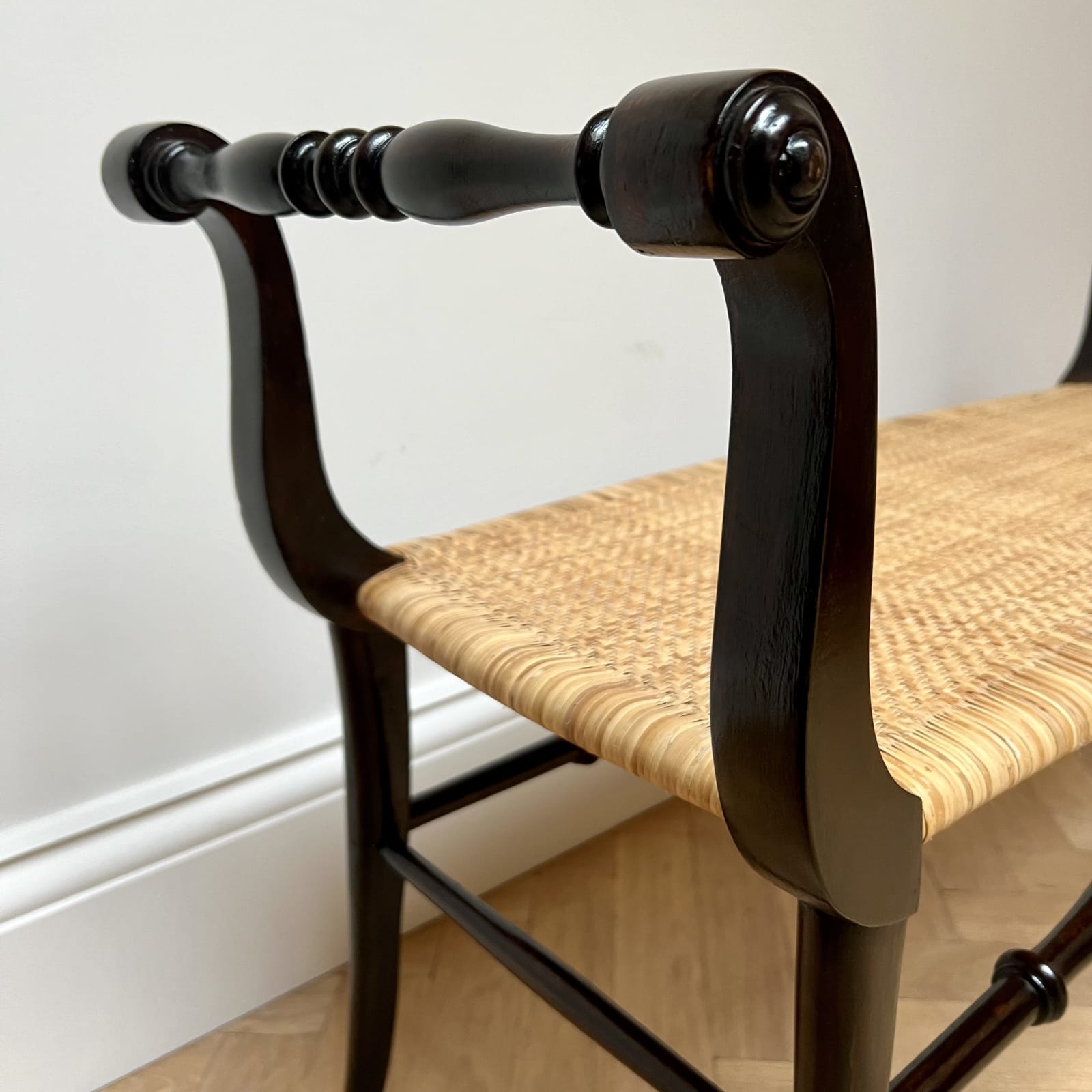 Italian, An Ebonized Wood and Rattan Bench, Circa 1950s