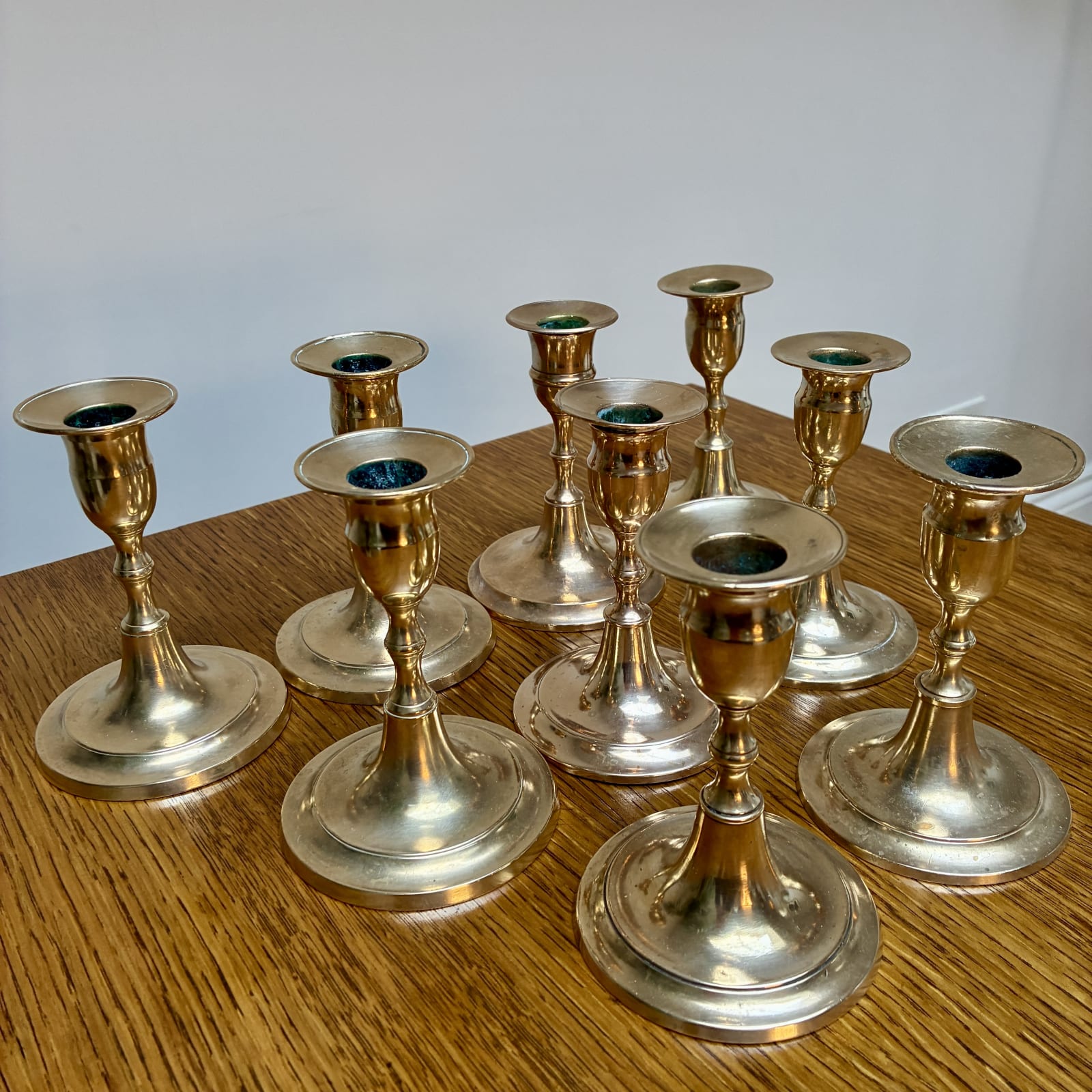 Swedish, A Collection of Nine Brass Candle Holders