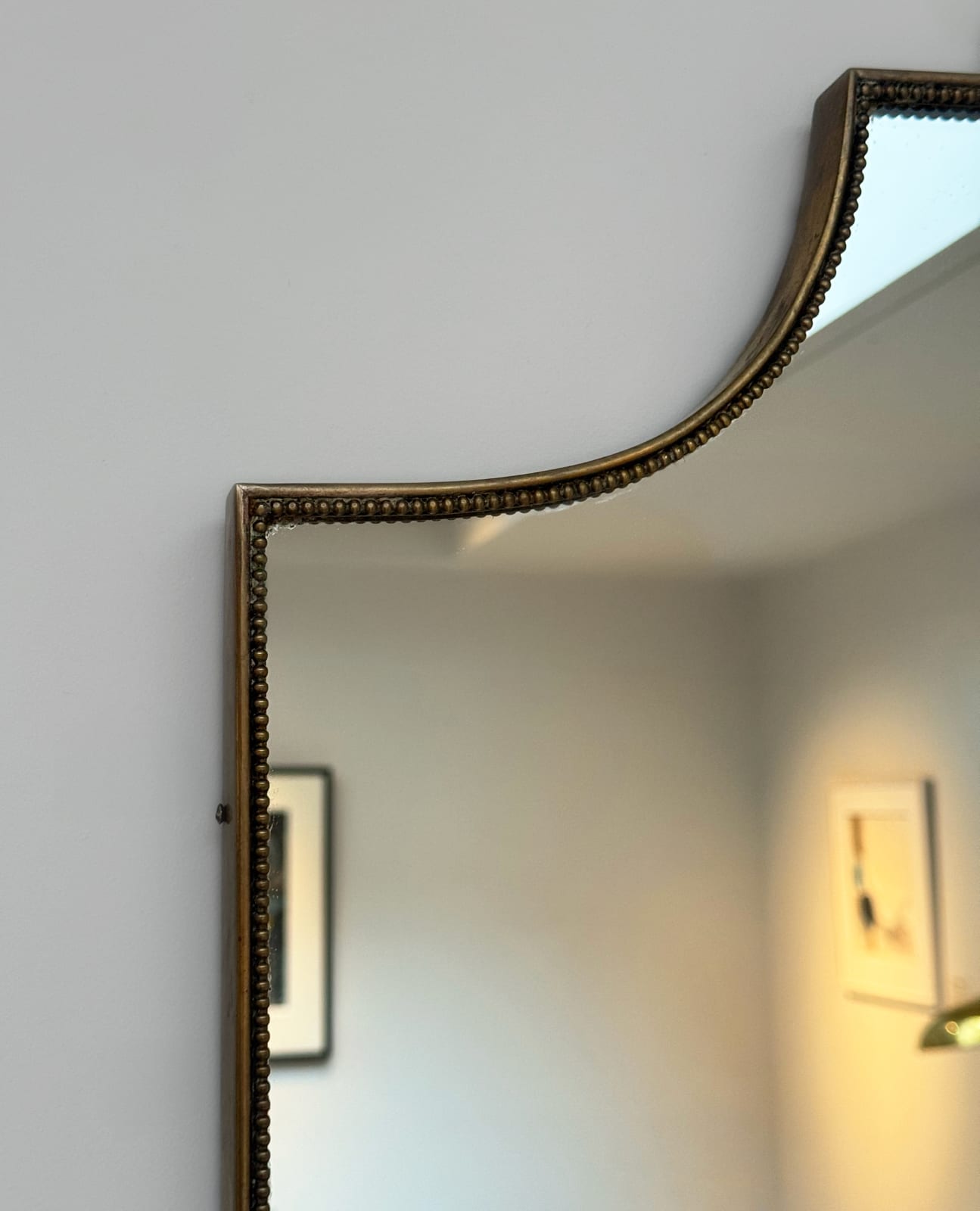 Italian, A Beaded Shield Mirror, circa 1960s