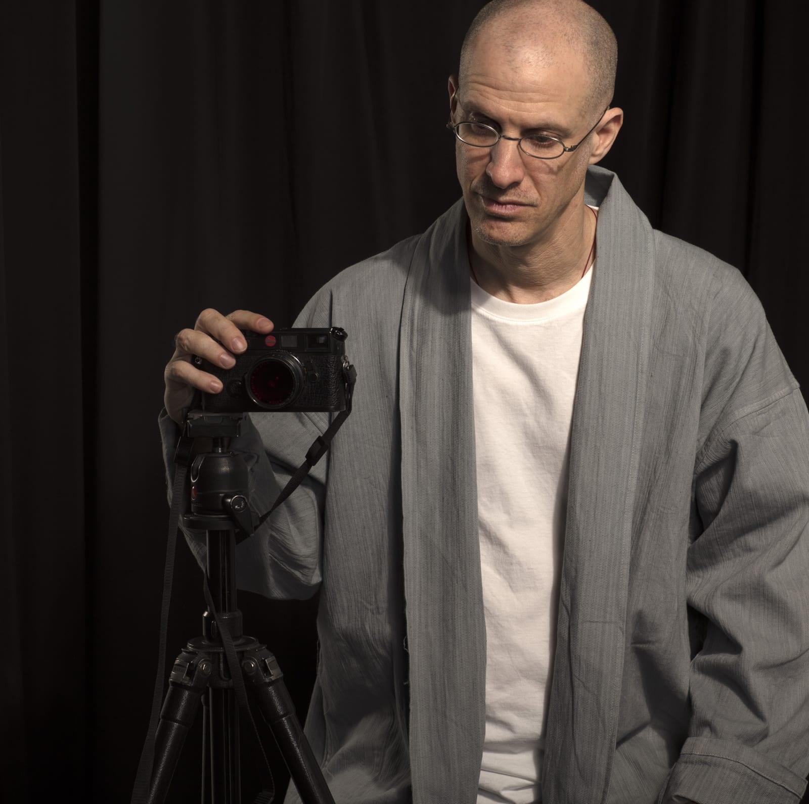 michael cherney standing next to his camera