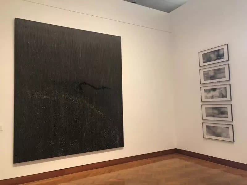 A picture containing indoor, wall, art, picture frame