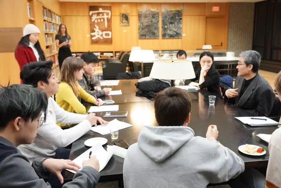 A group of people sitting around a table