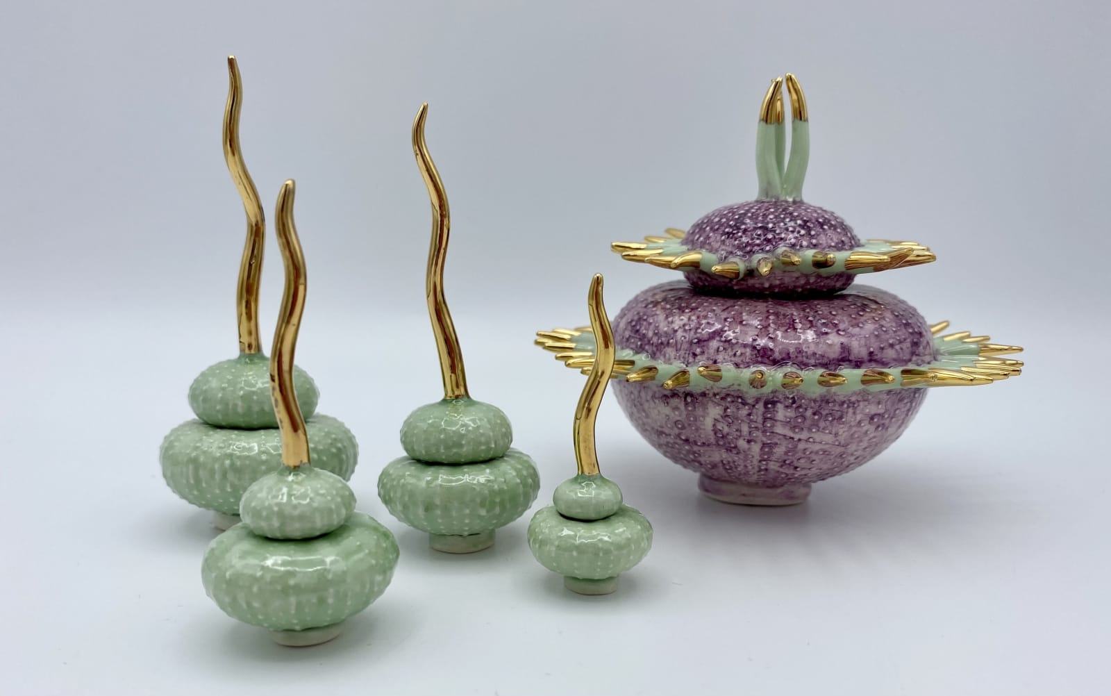 Delfina Emmanuel, Set of Four Aladdin Cachepots, Green with Gold Spike, 2022, Semi porcelain, Ballerina, Deep Lilac with Green Spikes, 2022, Semi porcelain.