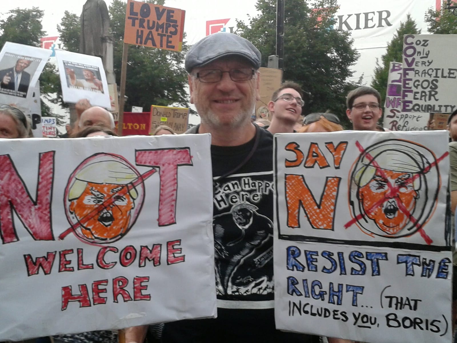 Photograph of a protester wearing a t-shirt emblazoned with an image of Sue Coe's "It Can Happen Here," July 2018 