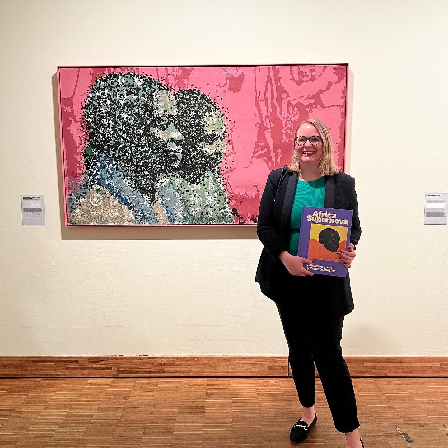 Gallery director Stella Melbye-Konan in front of the exhibited artwork Yeanzi