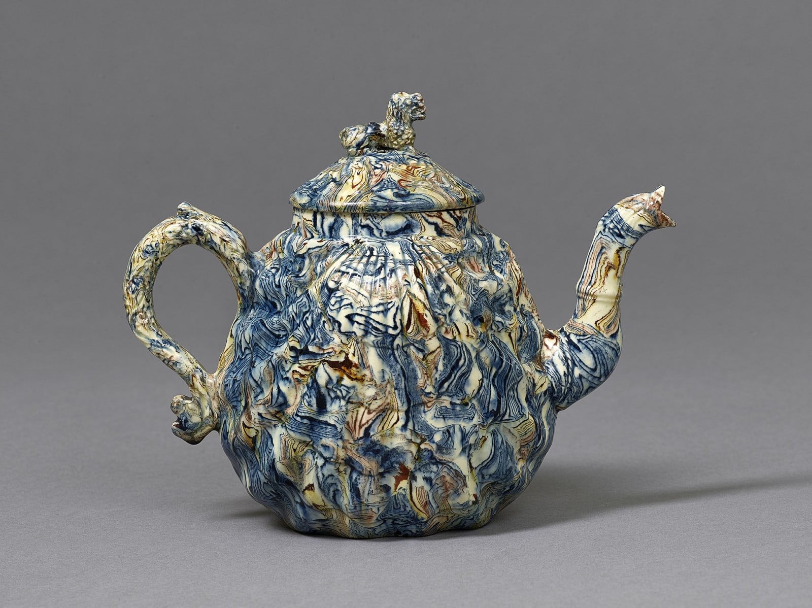 A Rare Staffordshire Agateware Pecten Shell Teapot and Cover, Circa 1750