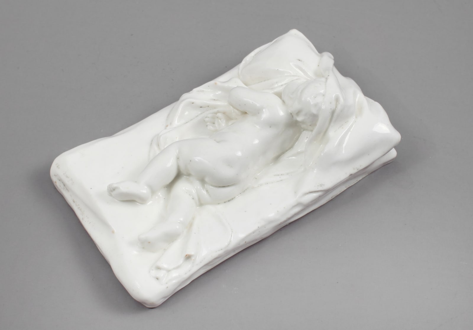 Rare and Important Chelsea Incised Triangle Period Porcelain Model of a Sleeping Child , Circa 1746