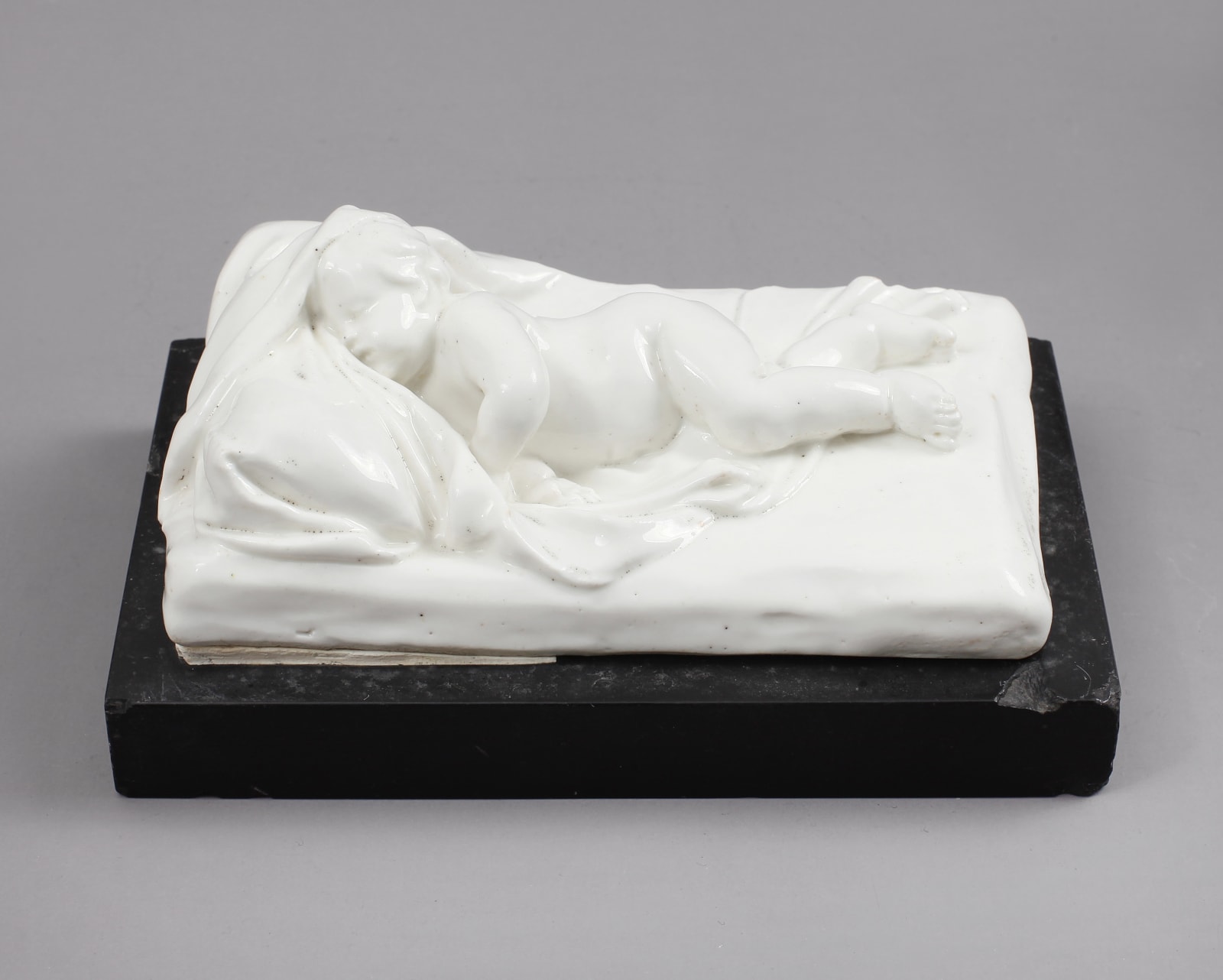 Rare and Important Chelsea Incised Triangle Period Porcelain Model of a Sleeping Child , Circa 1746