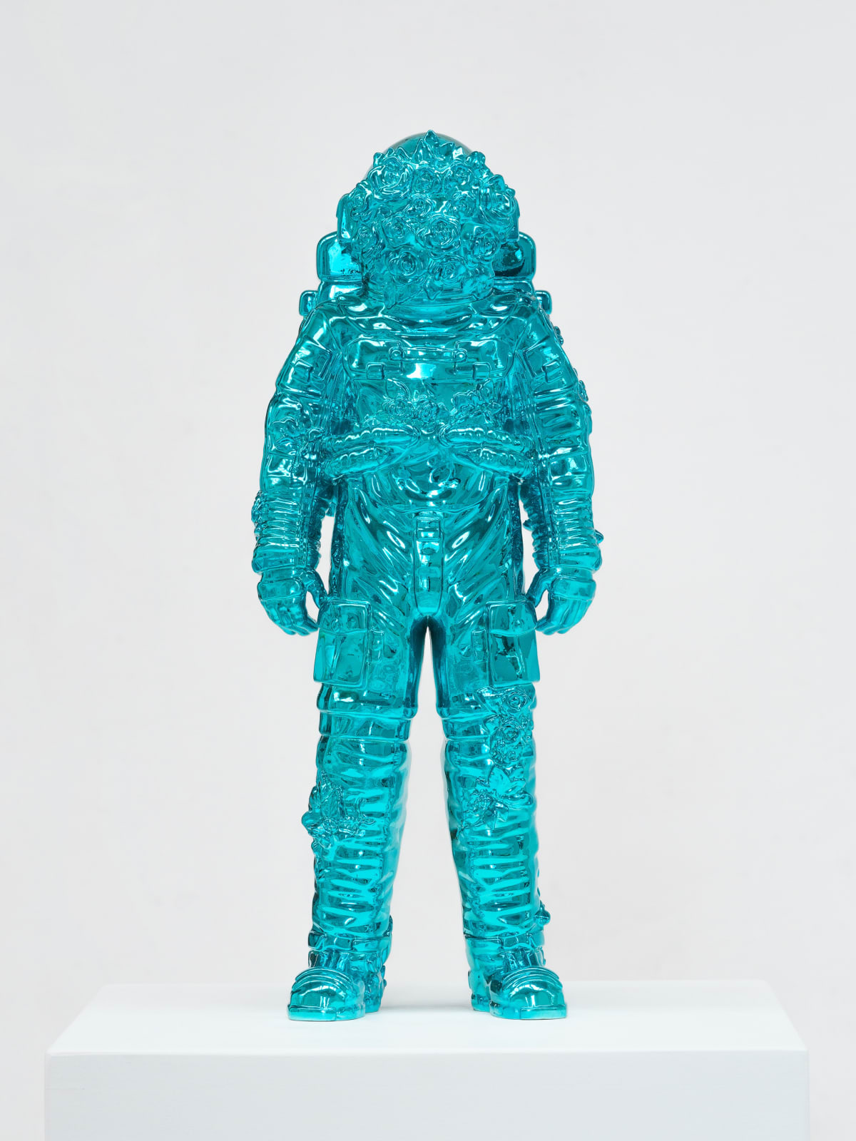 Marble sculpture featuring a spaceman his suit fill of flowers, part of the 'Spaceman Shine' series by artist Filippo Tincolini view from the front right