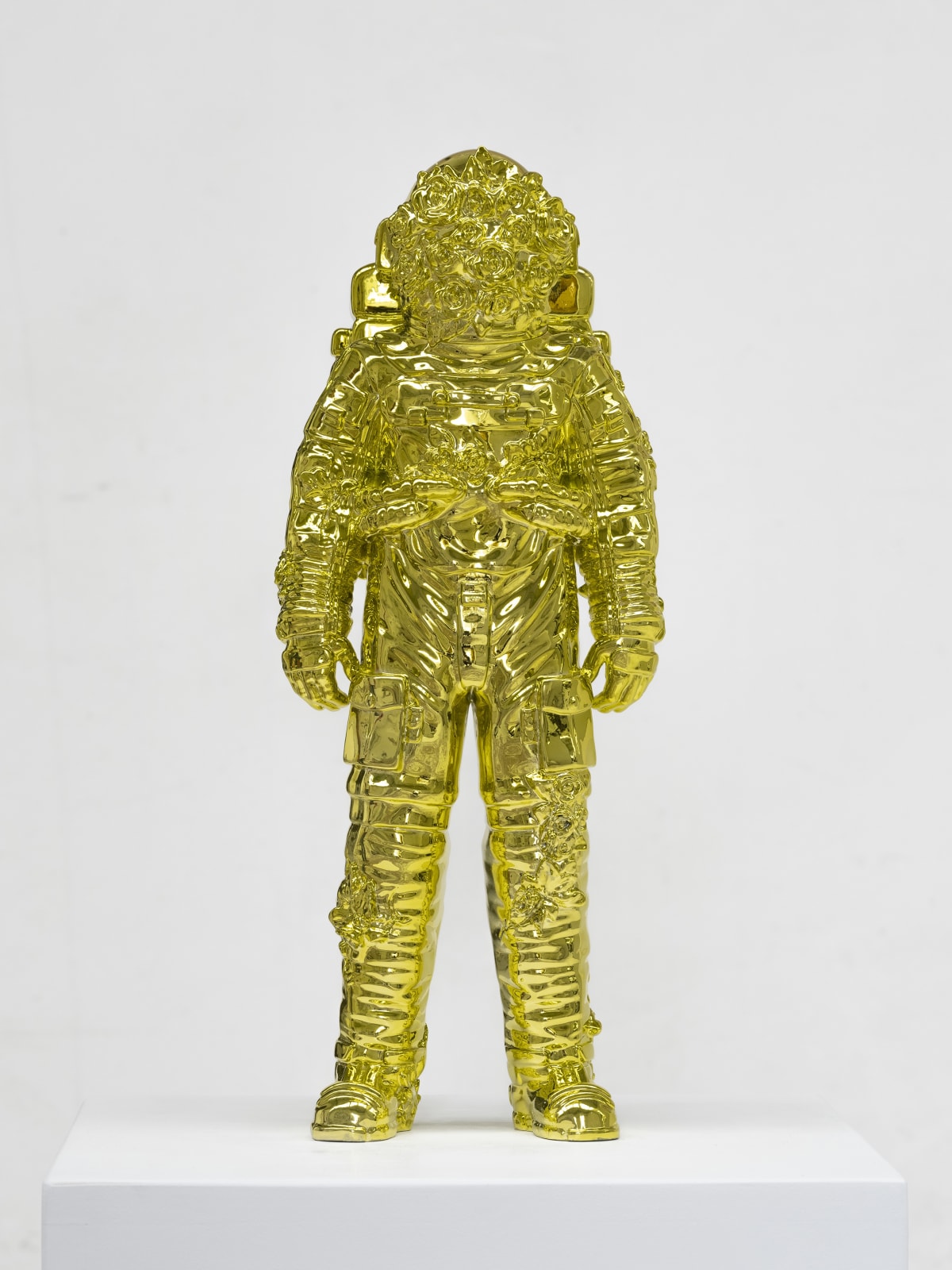 Marble sculpture featuring a spaceman his suit fill of flowers, part of the 'Spaceman Shine' series by artist Filippo Tincolini view from the front right