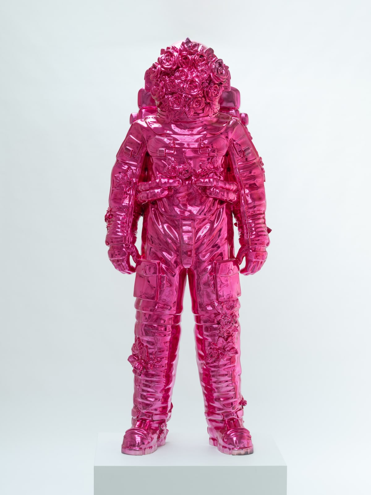 Marble sculpture featuring a spaceman his suit fill of flowers, part of the 'Spaceman Shine' series by artist Filippo Tincolini view from the front left