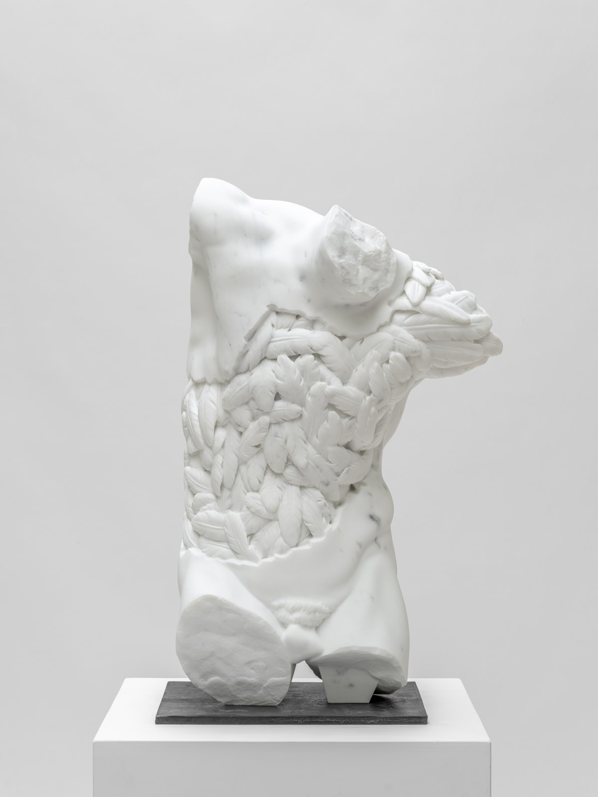 Marble sculpture featuring a satyr with a plumed inner soul, part of the 'Flowered Soul' series by artist Filippo Tincolini view from the front