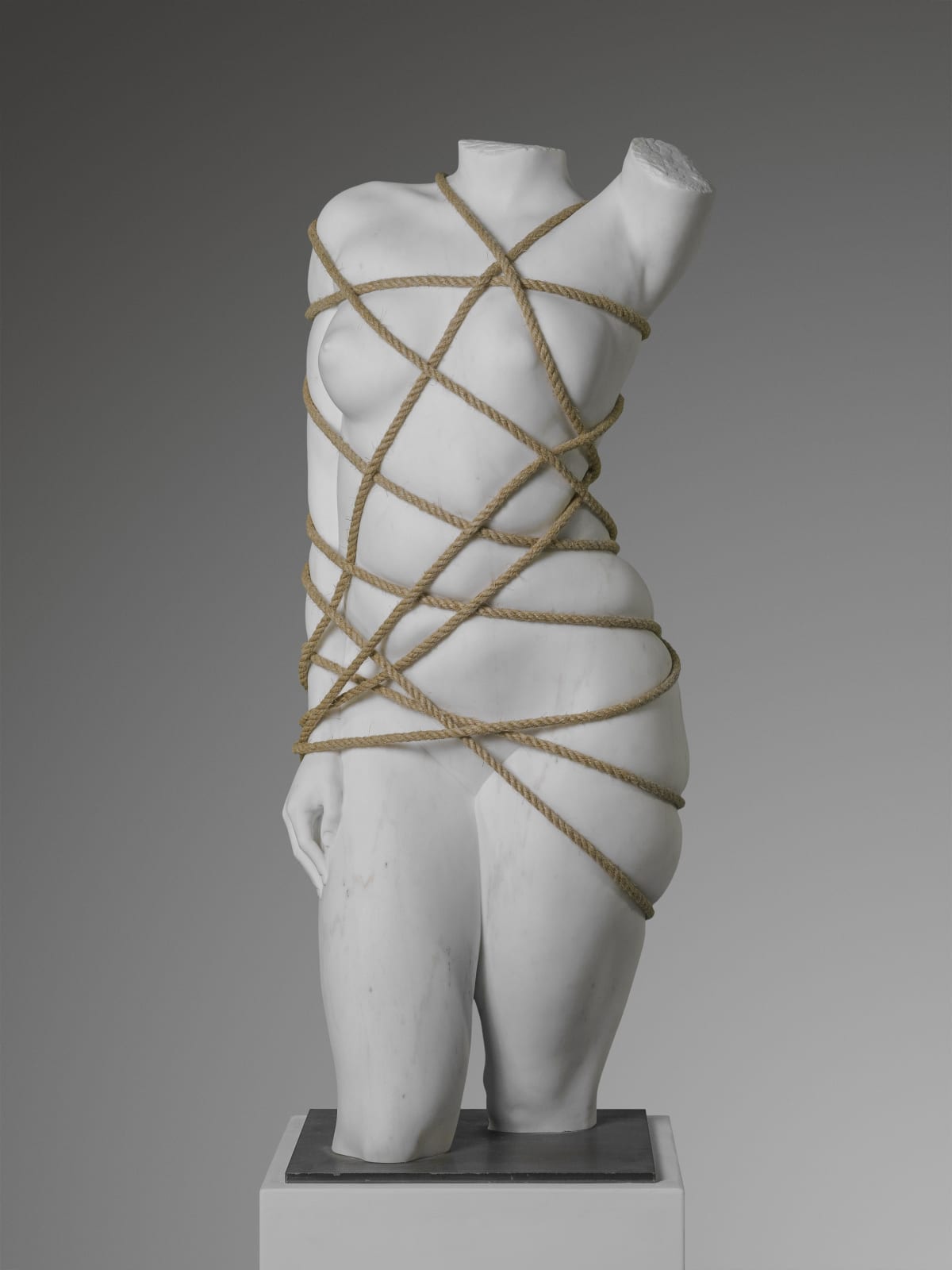 Marble sculpture featuring a Venus with ropes, part of the 'Swaddle' series by artist Filippo Tincolini view from the front