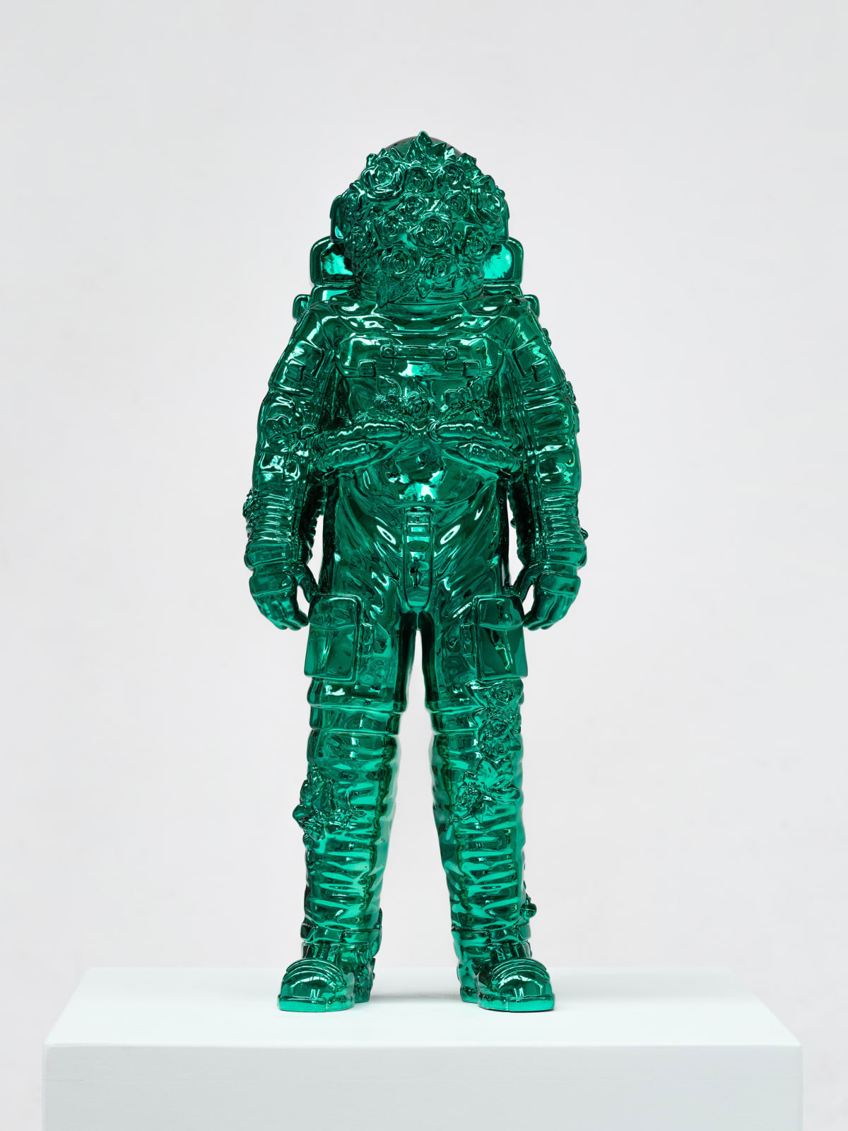 Marble sculpture featuring a spaceman his suit fill of flowers, part of the 'Spaceman Shine' series by artist Filippo Tincolini view from the front right