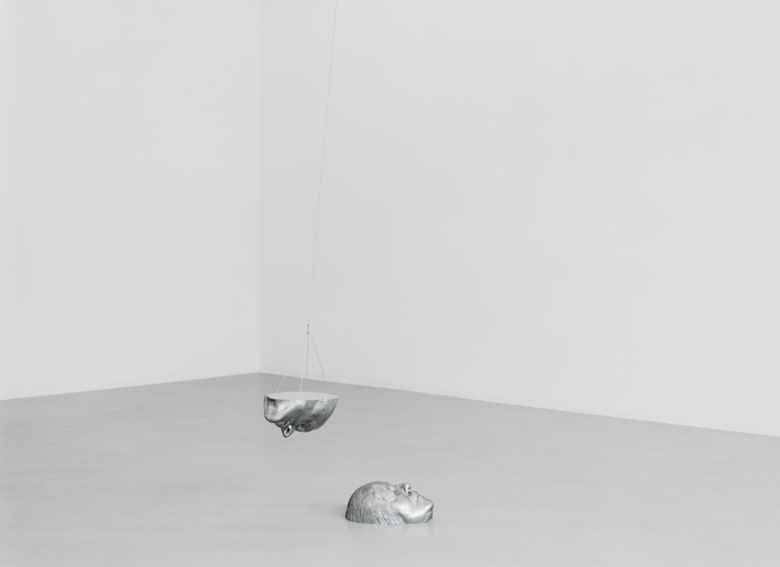 Anders Krisar, One as Two (2), Cast aluminum, magnets, lead, aluminum paint on aluminum plate, steel wire, wire lock, aluminum screws, copper pipe, plastic padding, chemical aluminum, and epoxy, 25.5x15x11cm, 24.5x16x10cm, 2004