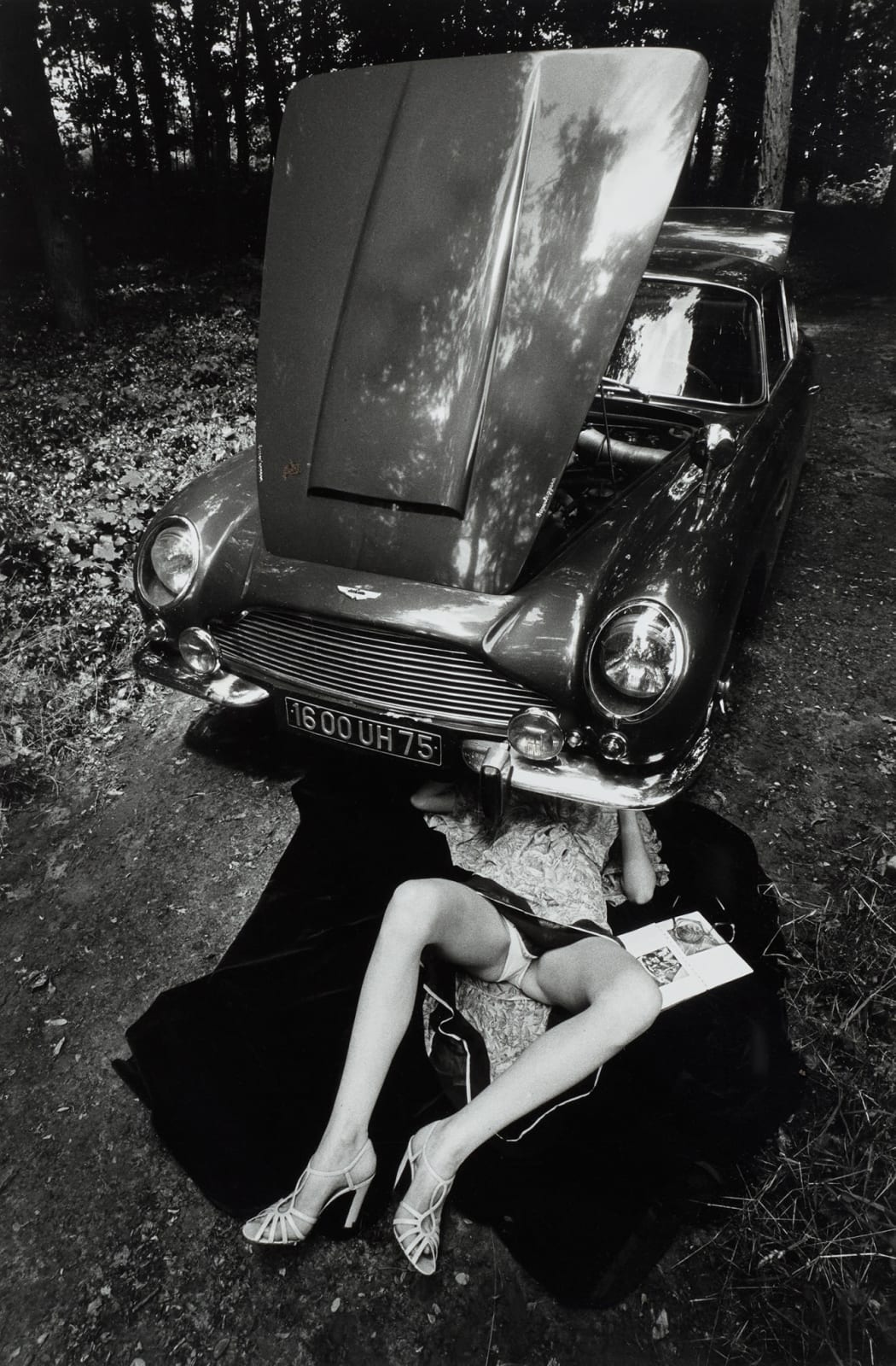 Jeanloup Sieff, Alone under a Car with Open Hood, Paris, 1975