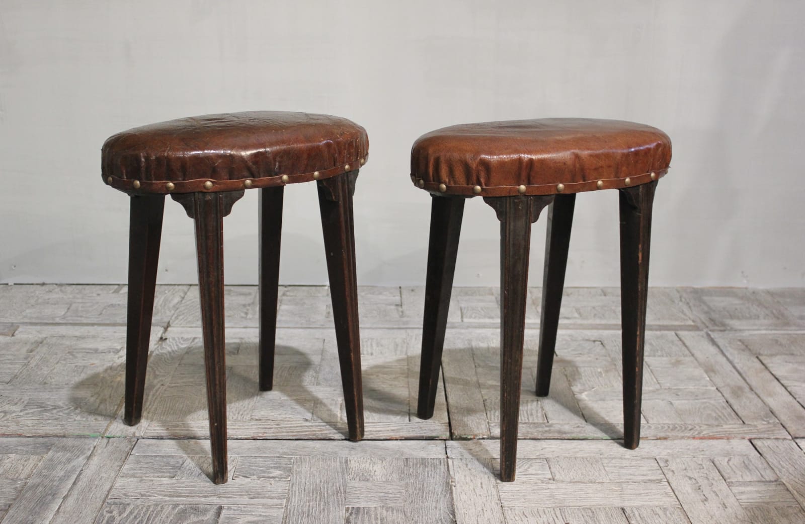 Pair of late 18th century English mahogany stools upholstered in leather