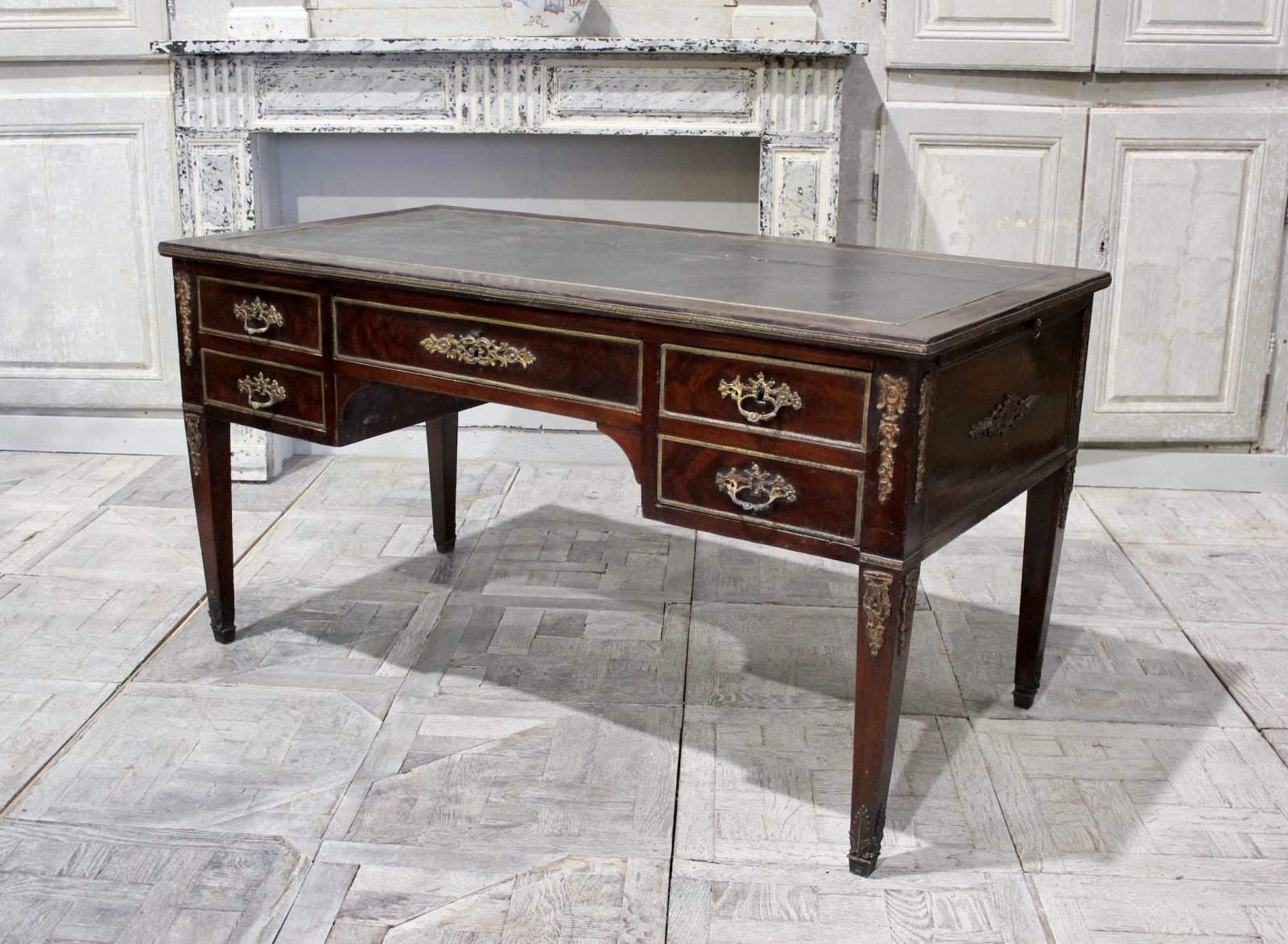 Early 19th century French mahogany and ormolu mounted leather top bureau plat