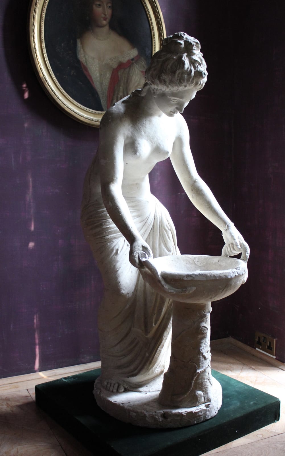 Large classical plaster figure of a water carrier