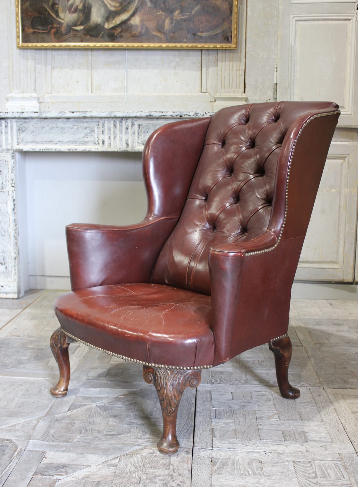 18th century English carved walnut wing chair in leather