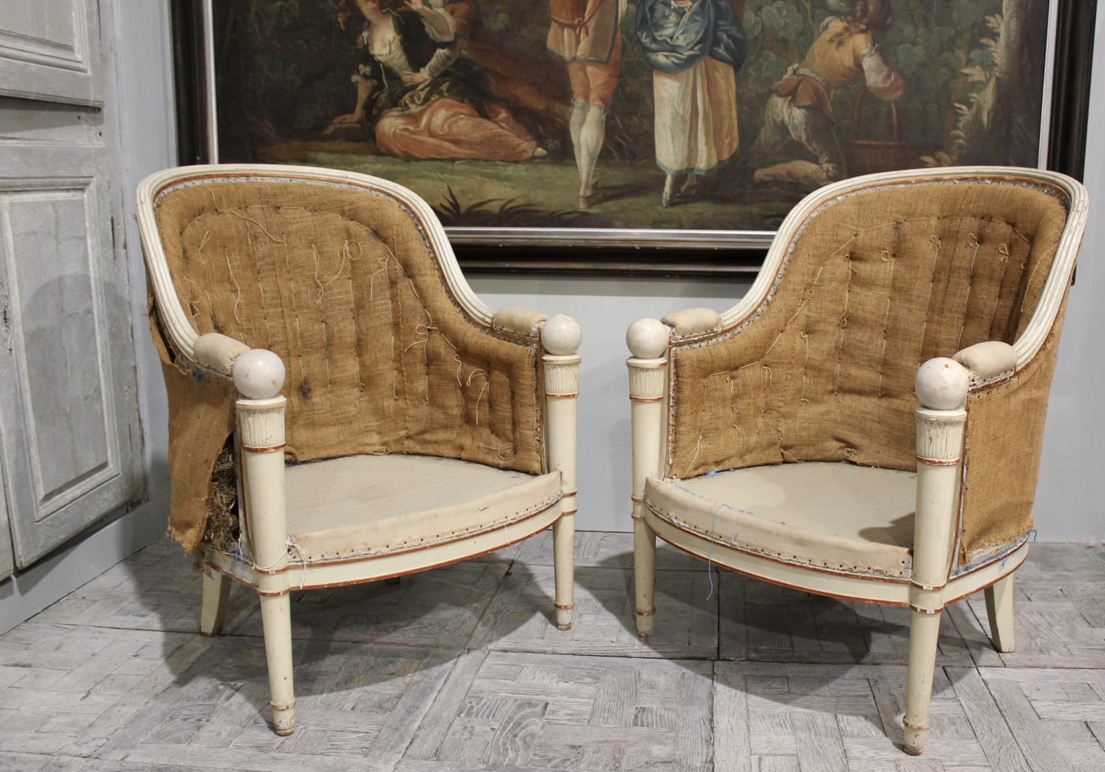 pair of 19th century French white painted and decorated tub armchairs