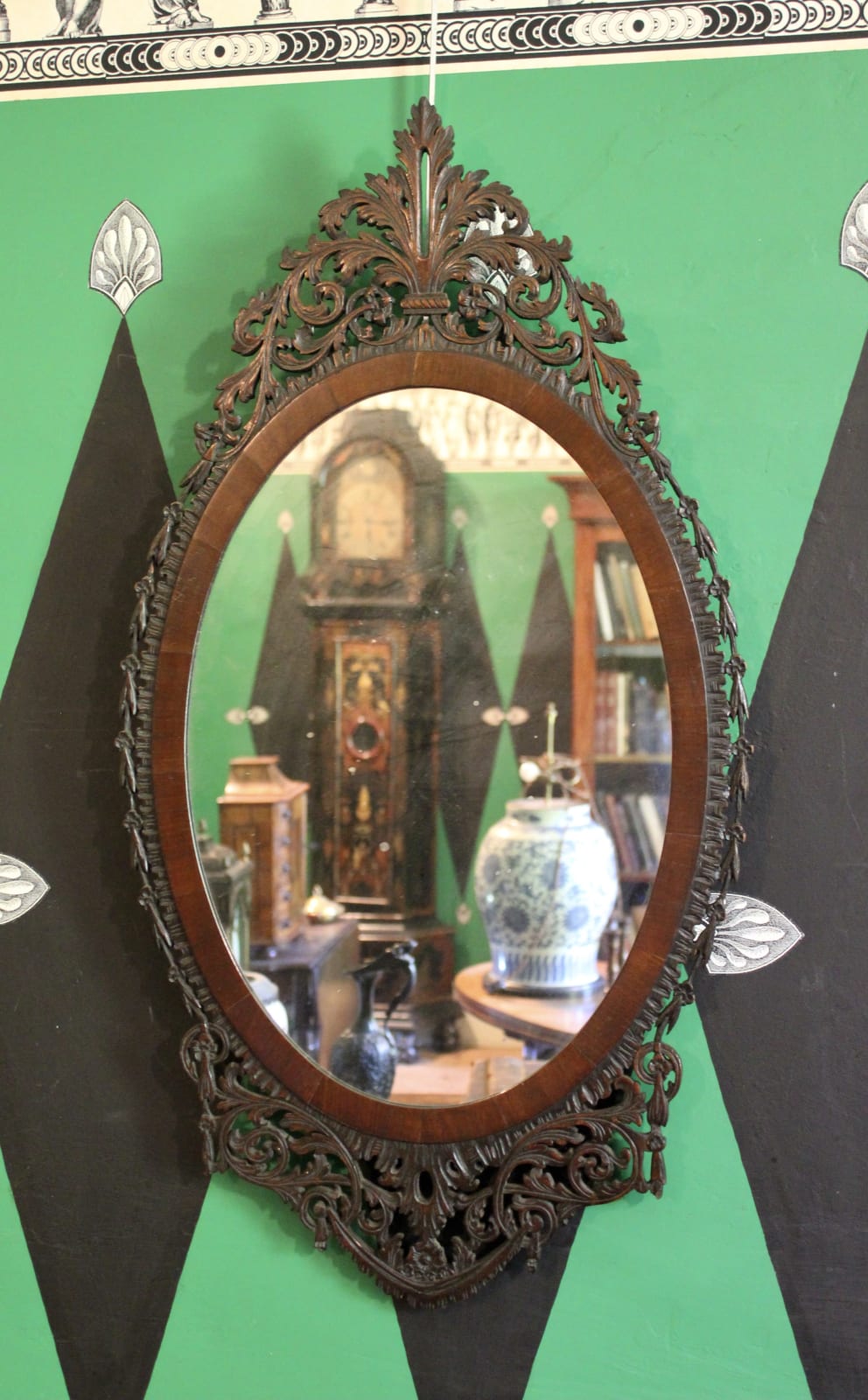 Pair of Irish oval fretwork mahogany mirrors, Circa 1800